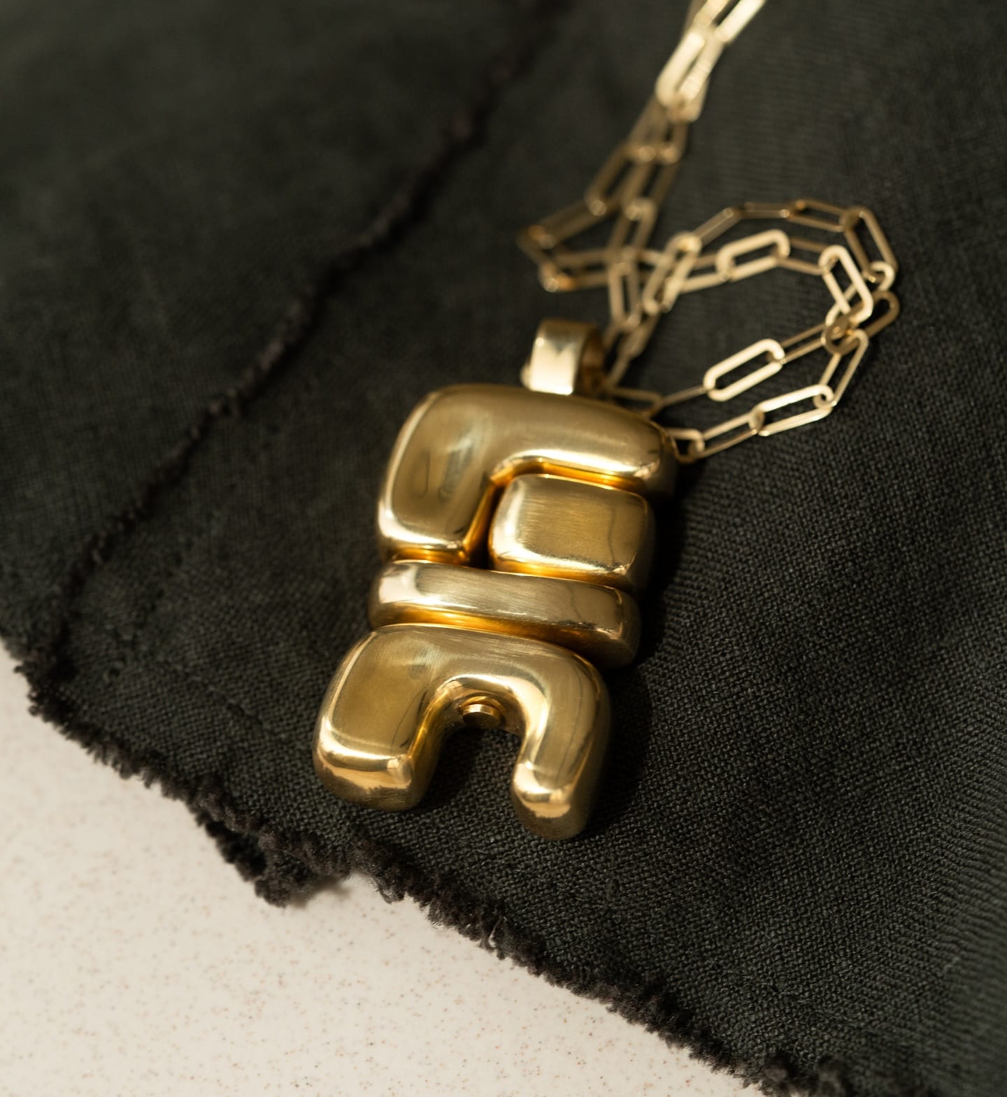 BOLD & BEAUTIFUL: This solid gold version of Joelle Kharrat’s beautifully balanced totem motif represents the element Air. Shop the collection at the link in bio at #AUBADEJEWELRY.